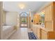 Bright bathroom featuring double vanities and tile flooring at 11421 Belle Meade Dr, Conifer, CO 80433