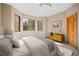 Comfortable bedroom featuring natural light, a ceiling fan, and stylish furnishings at 11421 Belle Meade Dr, Conifer, CO 80433