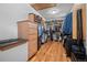 Spacious walk-in closet with custom shelving, drawers, and hardwood floors at 11421 Belle Meade Dr, Conifer, CO 80433