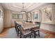 Elegant dining room featuring a large wooden table and stylish decor at 11421 Belle Meade Dr, Conifer, CO 80433