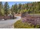 Elegant stone entrance to Belle Meade showcasing a private and gated community at 11421 Belle Meade Dr, Conifer, CO 80433