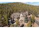 Beautiful exterior view of mountain home surrounded by lush trees at 11421 Belle Meade Dr, Conifer, CO 80433