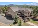 Beautiful home with a three-car garage, a deck with a jacuzzi, and outdoor dining, perfect for entertaining at 11421 Belle Meade Dr, Conifer, CO 80433