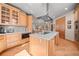 Spacious kitchen boasts a large island with modern appliances and ample cabinet space at 11421 Belle Meade Dr, Conifer, CO 80433