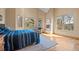Sun-filled main bedroom features a fireplace and multiple windows offering beautiful views at 11421 Belle Meade Dr, Conifer, CO 80433