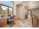 Office space featuring hardwood floors, a work desk, and a large window overlooking the outdoors at 11421 Belle Meade Dr, Conifer, CO 80433