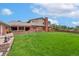 Large backyard with covered patio and brick barbecue station at 10101 W 72Nd Ave, Arvada, CO 80005