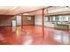 Large, unfinished basement with concrete floor and exposed red brick walls, perfect for storage at 10101 W 72Nd Ave, Arvada, CO 80005