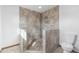 Newly renovated bathroom featuring a tiled shower with built in bench at 10101 W 72Nd Ave, Arvada, CO 80005