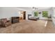 Spacious bedroom with neutral carpet and dual windows offering abundant natural light at 10101 W 72Nd Ave, Arvada, CO 80005