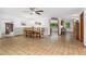 Dining area featuring a ceiling fan, a wooden table and 6 chairs, and tile flooring at 10101 W 72Nd Ave, Arvada, CO 80005