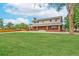Charming two-story home with brick accents, mature trees, and a well-maintained lawn at 10101 W 72Nd Ave, Arvada, CO 80005