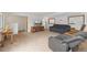 Comfortable living room features plush carpeting, comfortable furniture, and a large flat screen TV at 10101 W 72Nd Ave, Arvada, CO 80005