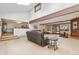 Bright living room with vaulted ceilings, cozy recliners, and exposed brick fireplace at 10101 W 72Nd Ave, Arvada, CO 80005