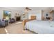 Spacious main bedroom featuring a brick fireplace, ceiling fan, and bright natural light at 10101 W 72Nd Ave, Arvada, CO 80005