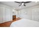 Large bedroom boasts hardwood floors, ceiling fan, and spacious closets at 11457 Nancys Dr, Conifer, CO 80433