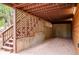 Spacious carport with lattice detail, providing covered parking and storage at 11457 Nancys Dr, Conifer, CO 80433