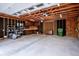 Well-organized garage featuring built-in storage, a work area, and concrete floors at 11457 Nancys Dr, Conifer, CO 80433