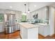 Bright kitchen features stainless steel appliances, a center island, and ample cabinet space at 11457 Nancys Dr, Conifer, CO 80433