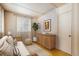 Cozy bedroom featuring neutral decor, natural light, and hardwood floors at 31948 Highway 72, Golden, CO 80403