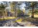 Home exterior with garage surrounded by mature trees at 31948 Highway 72, Golden, CO 80403