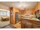 A kitchen with wood cabinets, stainless steel appliances and views to the dining room at 31948 Highway 72, Golden, CO 80403