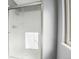 Close up of the updated shower with glass doors and modern fixtures at 12097 E Mexico Ave, Aurora, CO 80012