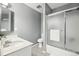 Modern bathroom featuring a shower/tub combo, and a vanity with white marble countertop at 12097 E Mexico Ave, Aurora, CO 80012