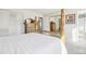 Cozy bedroom showcasing a wooden dresser, full size bed, and mirrored closet at 12097 E Mexico Ave, Aurora, CO 80012
