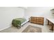 Cozy bedroom featuring a classic wooden dresser and a comfortable twin bed at 12097 E Mexico Ave, Aurora, CO 80012