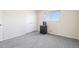 Bedroom features gray carpet, neutral walls, a window with natural light, and closet at 12097 E Mexico Ave, Aurora, CO 80012