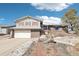 Charming home with brick accents, red shutters, and a well-maintained front yard at 12097 E Mexico Ave, Aurora, CO 80012