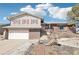 Charming two-story home with red shutters, brick accents, and a well-maintained front yard at 12097 E Mexico Ave, Aurora, CO 80012