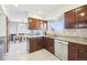 Charming kitchen with stainless steel appliances and a view of the dining area at 12097 E Mexico Ave, Aurora, CO 80012