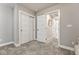 Neutral bedroom with carpet, closet doors, and a view to the hallway at 5654 N Emporia St, Denver, CO 80238