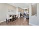 Inviting dining area with a round table, upholstered chairs, and seamless access to the bright and spacious living room at 5654 N Emporia St, Denver, CO 80238