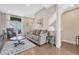 Cozy living room showcasing a plush sofa, stylish rug, and ample natural light from the glass doors leading outdoors at 5654 N Emporia St, Denver, CO 80238