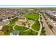 A neighborhood aerial view shows a park with a playground, grassy fields, and walking paths at 1181 W 170Th Ave, Broomfield, CO 80023