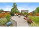 Landscaped backyard with patio, fire pit, and charming seating area at 1181 W 170Th Ave, Broomfield, CO 80023