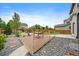 Charming backyard features a wooden deck perfect for relaxation and outdoor dining, surrounded by well-maintained landscaping at 1181 W 170Th Ave, Broomfield, CO 80023