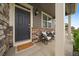 Inviting front porch with comfortable seating and stylish decor creating a welcoming entrance at 1181 W 170Th Ave, Broomfield, CO 80023