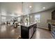 Kitchen with black cabinets, island, granite countertops, and stainless steel appliances at 1181 W 170Th Ave, Broomfield, CO 80023