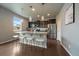 Modern kitchen island with granite countertops, pendant lighting, and seating for casual dining and entertaining at 1181 W 170Th Ave, Broomfield, CO 80023