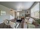 Inviting living room with a fireplace, neutral tones, and stairs in view at 1181 W 170Th Ave, Broomfield, CO 80023