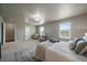 Spacious main bedroom featuring large windows, neutral colors, and plush carpeting at 1181 W 170Th Ave, Broomfield, CO 80023