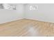 Bright, airy bedroom with hardwood floors and natural light from two windows at 2505 Upham St, Lakewood, CO 80214