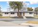 Inviting single-story home with a new roof, fresh exterior paint, and attractive landscaping showcasing its curb appeal at 2505 Upham St, Lakewood, CO 80214