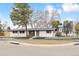 Street view of a renovated single-story home with fresh paint, a new roof, and simple landscaping in a quiet neighborhood at 2505 Upham St, Lakewood, CO 80214