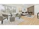 Bright and airy living room featuring stylish furniture, hardwood floors, and large windows for ample natural light at 2505 Upham St, Lakewood, CO 80214