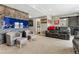 Finished basement featuring stone accent wall with built-in aquarium and comfortable seating area at 7301 S Shady Grove Way, Aurora, CO 80016